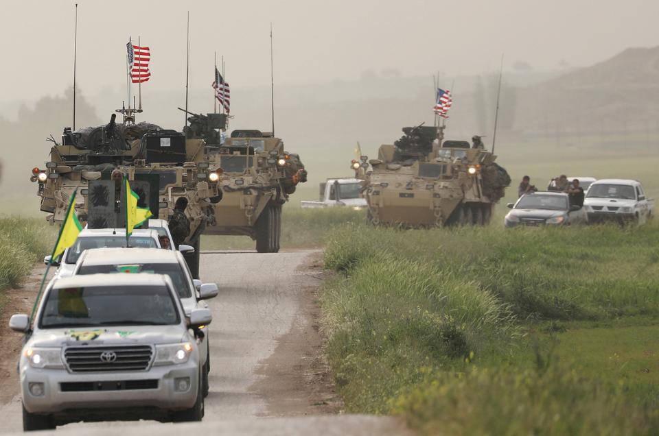 The YPG heads a convoy of US military vehicles in the town of Darbasiya, next to the Turkish border, in Syria, April 28, 2017.