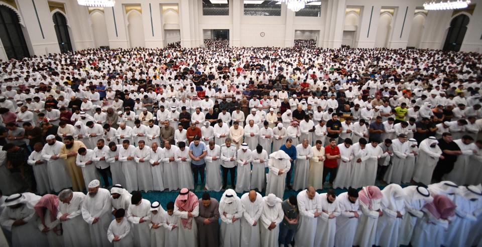 Muslims stand inside at Al-Ghanim and Al-Kharafi Mosque in prayers during the Laylat al Qadr in Kuwait City, Kuwait.