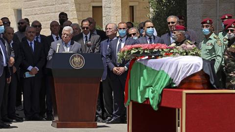 Palestinian president Mahmud Abbas bids farewell to veteran Al-Jazeera journalist Shireen Abu Akleh during a state funeral at the presidential headquarters in Ramallah.